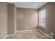 Neutral bedroom featuring a window for natural light and plush carpeting at 10001 Wild Dogwood Ct, Charlotte, NC 28273