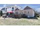 View of the home's backyard featuring a wooden deck with a red umbrella at 1001 Parkwood Ave, Charlotte, NC 28205