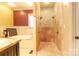 Luxurious bathroom features a standalone shower with dual shower heads and a soaking tub under a window at 1001 Parkwood Ave, Charlotte, NC 28205