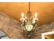 Ornate chandelier with crystals and candle lights creates an elegant statement at 1001 Parkwood Ave, Charlotte, NC 28205