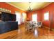 Bright dining area boasts hardwood floors, neutral furniture, and large windows providing natural light at 1001 Parkwood Ave, Charlotte, NC 28205