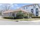 A corner lot featuring a home with neutral siding, neat hedges, and street signage at 1001 Parkwood Ave, Charlotte, NC 28205