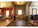 Welcoming foyer with stone accent wall, chandelier, unique flooring and open archways to adjoining living spaces at 1001 Parkwood Ave, Charlotte, NC 28205