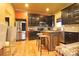 Modern kitchen with stainless steel appliances, dark wood cabinets, and a kitchen island at 1001 Parkwood Ave, Charlotte, NC 28205