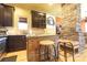Quaint kitchen with a stylish center island with barstool seating, stainless steel appliances at 1001 Parkwood Ave, Charlotte, NC 28205