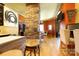 Inviting open concept living area with a stone pillar and hardwood floors at 1001 Parkwood Ave, Charlotte, NC 28205