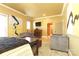 Large main bedroom boasting hardwood floors, a ceiling fan, seating and neutral decor at 1001 Parkwood Ave, Charlotte, NC 28205