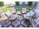 Comfortable outdoor seating area with a rug, chairs, cushions, and a small glass table at 1001 Parkwood Ave, Charlotte, NC 28205