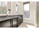 Bathroom with double vanity, granite counters, espresso cabinetry, tile flooring, and a window at 1037 Pierre Dr, Charlotte, NC 28205