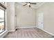 Bright bedroom featuring neutral walls, carpet, ceiling fan, and a large window at 1037 Pierre Dr, Charlotte, NC 28205