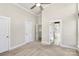 Bedroom featuring neutral walls, carpet, ceiling fan, and a view into the bathroom at 1037 Pierre Dr, Charlotte, NC 28205