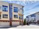 Modern townhome with a two-car garage and colorful exterior featuring contemporary architectural details at 1037 Pierre Dr, Charlotte, NC 28205