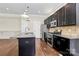 Modern kitchen with granite counters, stainless steel appliances, and dark cabinetry at 1037 Pierre Dr, Charlotte, NC 28205