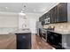 Open kitchen with granite counters, stainless appliances, a center island, and a tile backsplash at 1037 Pierre Dr, Charlotte, NC 28205
