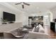 Open-concept living room with modern furnishings, updated appliances, and eat-in bar area at 1037 Pierre Dr, Charlotte, NC 28205
