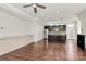 Open-concept living space featuring hardwood floors, modern lighting, and a kitchen island with stainless appliances at 1037 Pierre Dr, Charlotte, NC 28205