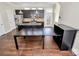 Open living room and kitchen with hardwood floors, a center island, stainless steel appliances, and modern fixtures at 1037 Pierre Dr, Charlotte, NC 28205