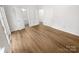 Bright bedroom with wood flooring and access to ensuite bathroom and walk in closet at 1269 E Woodlawn Rd, Charlotte, NC 28209