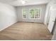 Bright bedroom with large windows and plush carpet at 1269 E Woodlawn Rd, Charlotte, NC 28209