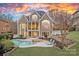 Stunning backyard featuring a pool, spa, and spacious patio perfect for outdoor entertaining at 13500 Robert Walker Dr, Davidson, NC 28036