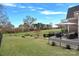 Picturesque backyard view highlighting the deck, lush lawn, and serene landscape, ideal for outdoor enjoyment at 13500 Robert Walker Dr, Davidson, NC 28036