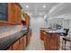 Finished bar area with dark countertops, custom cabinetry, and modern tile backsplash at 13500 Robert Walker Dr, Davidson, NC 28036