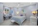 Bright bedroom with a full-sized bed, desk, and decoratively appointed walls at 13500 Robert Walker Dr, Davidson, NC 28036
