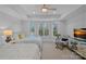 Well-lit bedroom with two twin beds, bay window, and backyard pool view at 13500 Robert Walker Dr, Davidson, NC 28036