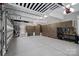 Well-organized garage featuring ample storage cabinets, epoxy floor, and overhead racks for maximum space utilization at 13500 Robert Walker Dr, Davidson, NC 28036