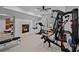 Spacious home gym with a fireplace and an array of workout equipment, perfect for staying active and healthy at 13500 Robert Walker Dr, Davidson, NC 28036