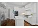 Modern kitchen with stainless steel appliances, custom white cabinetry, and center island at 13500 Robert Walker Dr, Davidson, NC 28036