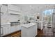 Bright kitchen features a double island, stainless steel appliances, and eat-in dining at 13500 Robert Walker Dr, Davidson, NC 28036