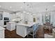 Bright kitchen with custom cabinets, center island, stainless steel appliances, and breakfast nook nearby at 13500 Robert Walker Dr, Davidson, NC 28036