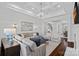 Open-concept living room with comfortable seating, stylish decor, and hardwood floors, ideal for relaxation and entertainment at 13500 Robert Walker Dr, Davidson, NC 28036