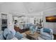 Spacious living room connected to kitchen, with large windows and comfortable seating area at 13500 Robert Walker Dr, Davidson, NC 28036