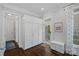Mudroom boasts custom cabinet storage, natural light, and access to backyard at 13500 Robert Walker Dr, Davidson, NC 28036