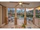 Covered patio with stone columns, an outdoor lounge area, and a stunning sunset view overlooking the pool at 13500 Robert Walker Dr, Davidson, NC 28036