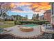 Relaxing backyard pool and spa area with well-maintained landscaping and outdoor seating, perfect for entertaining at 13500 Robert Walker Dr, Davidson, NC 28036