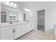 A spacious bathroom with double vanity and a large mirror at 136 Glenn Dr, Mooresville, NC 28115