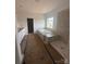 New bathroom featuring a soaking tub, step-in shower, tile surround, and white vanity at 136 Glenn Dr, Mooresville, NC 28115