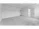 A light bedroom features attached bathroom and plenty of space at 136 Glenn Dr, Mooresville, NC 28115