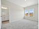 Spacious bedroom with neutral carpet and access to ensuite bathroom at 136 Glenn Dr, Mooresville, NC 28115
