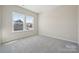 Bedroom with natural light streaming in from two windows at 136 Glenn Dr, Mooresville, NC 28115