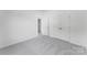 This bedroom features a walk-in closet and bright white walls at 136 Glenn Dr, Mooresville, NC 28115