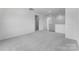 Spacious bonus room with neutral carpeting and light-colored walls, offering flexibility for various uses at 136 Glenn Dr, Mooresville, NC 28115