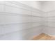Walk-in closet space with adjustable wire shelving and light wood flooring at 136 Glenn Dr, Mooresville, NC 28115