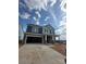 New two story home with stone accents, attached two car garage, covered porch, and desirable curb appeal at 136 Glenn Dr, Mooresville, NC 28115