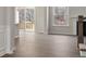 Spacious living room with wood floors, a fireplace, and sliding doors leading to outdoor living at 136 Glenn Dr, Mooresville, NC 28115