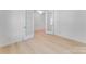 Bright room with French doors leading into the space, light hardwood floors, and decorative wall trim at 136 Glenn Dr, Mooresville, NC 28115