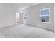 Primary bedroom with a bathroom and 2 windows at 136 Glenn Dr, Mooresville, NC 28115